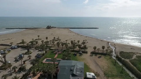 Aerial 3 shots sequence of ancient tower at the beach at sunset Stock Footage 89778241