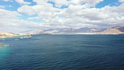 Aerial 360 degrees view of the Red Sea from the Israeli side, facing Jordan. Video stock 143473140