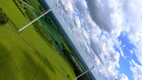 Aerial 360 Infinity Wind Turbines Yellow Rapeseed Field Landscape Vidéo 337186187