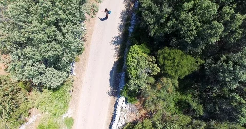 AERIAL 4K Athletic man doing energetic surf style turns on a skateboard Stock Footage 119491902