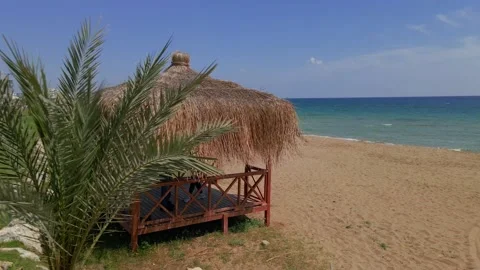 Aerial 4k beach hut on the sandy beach in North Cyprus Stock-Footage 172415892