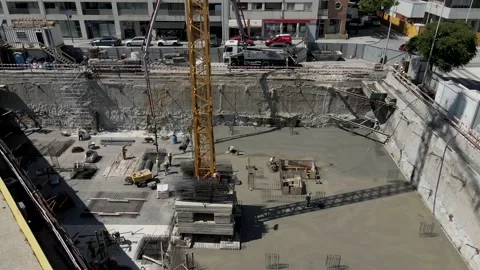 Aerial 4K: Construction site, workers pouring concrete Stock Footage 134512798