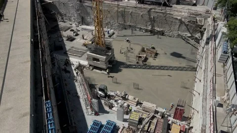 Aerial 4K: Construction site, workers pouring concrete Stock Footage 134512948