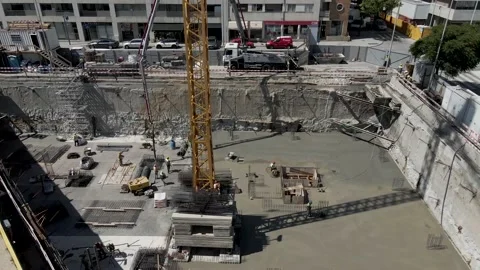Aerial 4K: Construction Site, workers pouring concrete Stock Footage 134513651