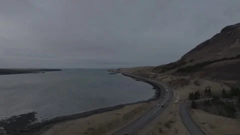 Aerial 4K drone flight forward over a winding coastal highway in Iceland Vídeo Stock 332657164