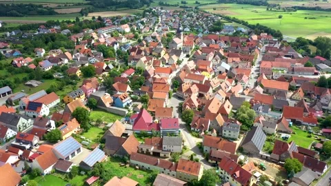 Aerial 4K drone flight over a typical provincial German village Stock Footage 199434861