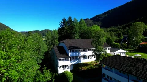 Aerial 4K drone flight view white Norway house-Fotlandsvag Village reverse Stock-Footage 200893408