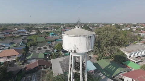 Aerial 4K Drone Footage Circling Water Tank in Rural Area – Cinematic Shot Stock Footage 308703953