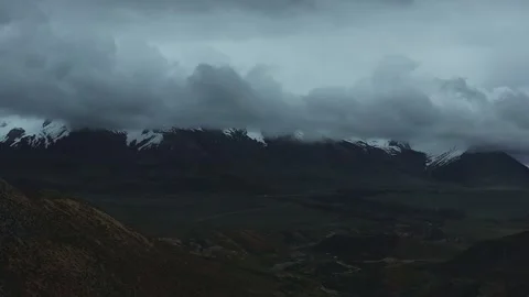 Aerial 4K Drone Time-lapse Thick Rolling Clouds Over Dark Mountain Forest Stock Footage 336857413
