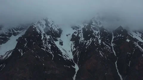 Aerial 4K Drone Time-lapse of Majestic Snow Mountain Peaks and Epic Clouds 動画素材 336857549