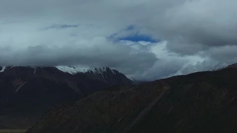 Aerial 4K Drone Time-lapse Thick Rolling Clouds Over Dark Mountain Forest Stock Footage 336857552