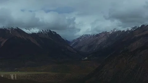 Aerial 4K Drone Time-lapse Thick Rolling Clouds Over Dark Mountain Forest Stock Footage 336862449