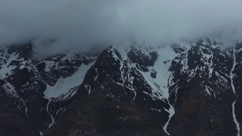 Aerial 4K Drone Time-lapse of Majestic Snow Mountain Peaks and Epic Clouds Stock Footage 336862474
