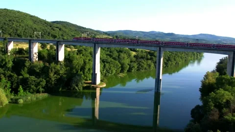 Aerial 4K drone view ETR 1000 Freccia Rossa passes by Rail high speed bridge Stock Footage 196255272