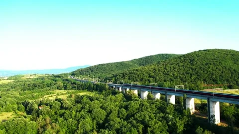 Aerial 4K drone view ETR 500 up Freccia Rossa passes by Rail high speed bridge Stock Footage 196255733