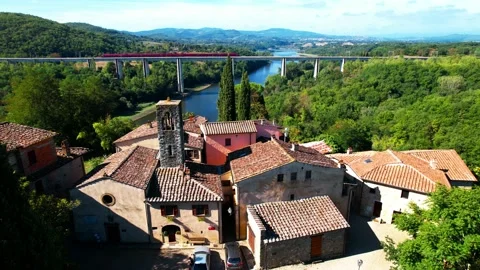 Aerial 4k drone view fast Italo train passes by rail line bridge Italy above Stock-Footage 229559663