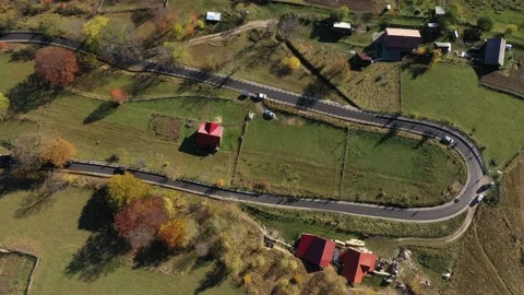 Aerial 4k drone view of flying over a winding serpentine asphalt road Stock Footage 174051248
