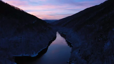 Aerial 4k drone view of a lake at winter during the blue hour Stock Footage 101371628