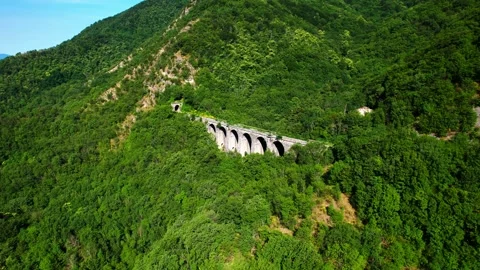 Aerial 4k drone view reverse Valdicampi Rail Bridge Tuscany Faentina Rail line Stock Footage 197562670