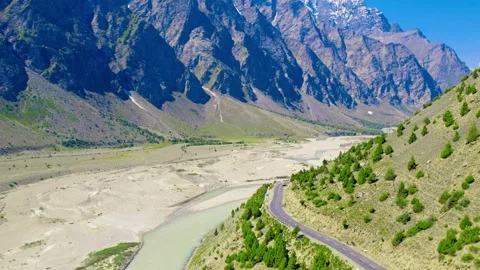 Aerial 4K Drone View of River Flowing Through Mountain Valley -Natural Landscape Stock Footage 307763198
