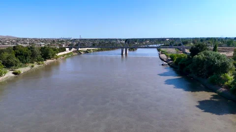 Aerial 4K Drone View of a Steel Railway Bridge Crossing a River 스톡 동영상 342740468
