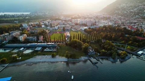 Aerial 4k drone view of a sunset in Locarno, Swiss lake town. Stock Footage 248708311