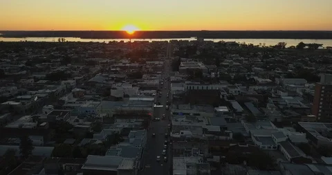 Aerial 4K - Flying over small city in the coastline on sunset Stock Footage 85647192