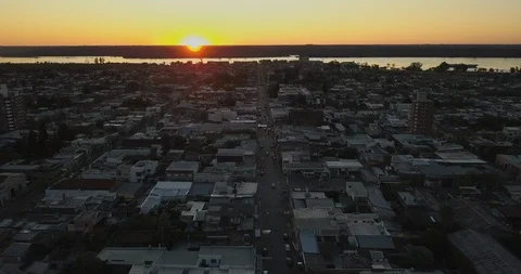 Aerial 4K - Flying over small city in Uruguay, South America on sunset Stock Footage