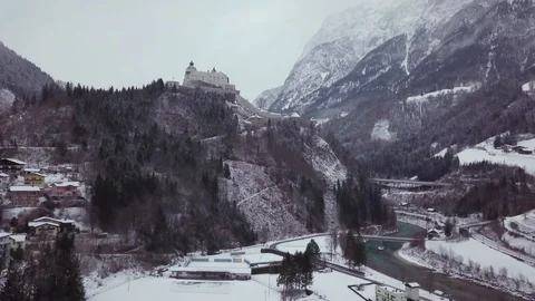 Aerial 4k footage of castle and a village in a winter mountains Stock Footage