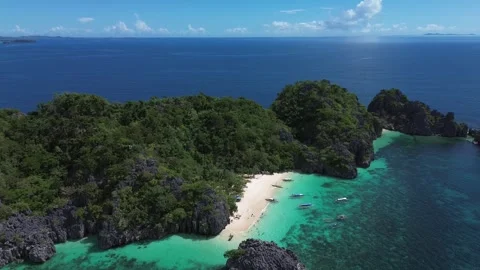 Aerial 4K: High Angle Horizon View of Remote Tropical Island and Deep Blue Ocean Stock Footage 343484387