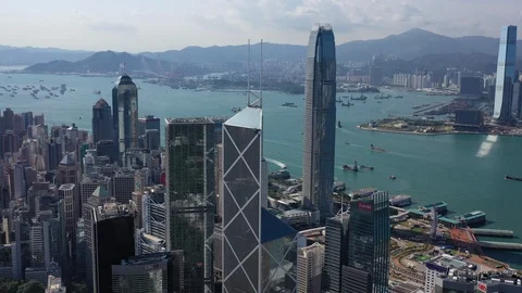 Aerial : 4K Hong Kong Bank of China Victoria Harbour sunny day Stock Footage