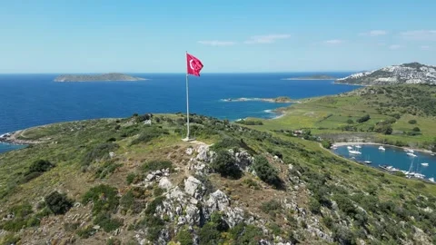 Aerial 4K Orbit Around Large Turkish Flag on a Hill Overlooking Sea Stock Footage 331879046