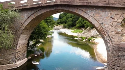 Aerial 4K shot of stone bridge and river Pilima Xanthi in Greece Stock Footage
