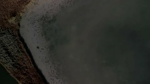 Aerial 4k top down overhead video of a pond and river Stock Footage 220243449