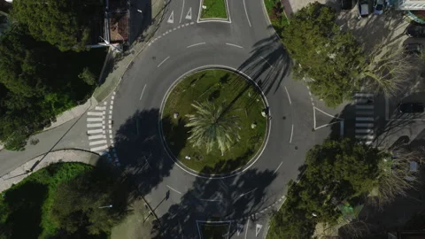 Aerial 4K top view of roundabout in the city with city transport Video stock 327671102