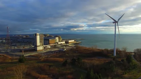 Aerial 4K UHD - Windmill rotating at Canadian power generator plant Video stock 57925504
