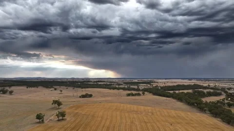 Aerial 4k video of dramatic storm clouds over farmland Stock Footage 319454312