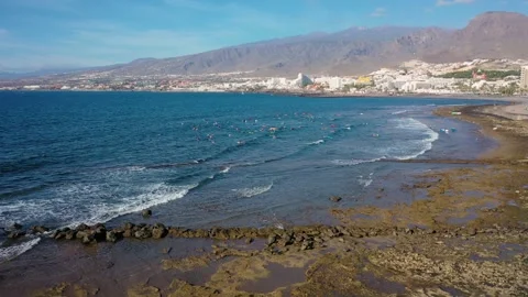 Aerial 4K video from drone to de surfers in the ocean beachs Stock Footage 265202145