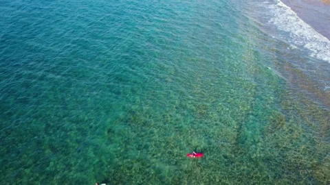 Aerial 4K video from drone to de surfers in the ocean beachs Stock Footage 265202182