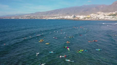 Aerial 4K video from drone to de surfers in the ocean beachs Stock Footage 265202216