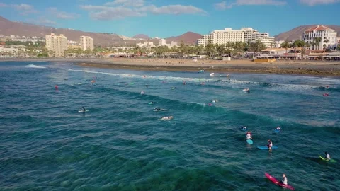 Aerial 4K video from drone to de surfers in the ocean beachs Stock Footage 265202228
