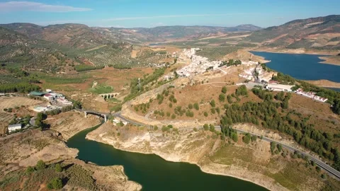 Aerial 4K video from drone to town Iznajar at sunset. Andalusia, Spain Stock Footage 279344530