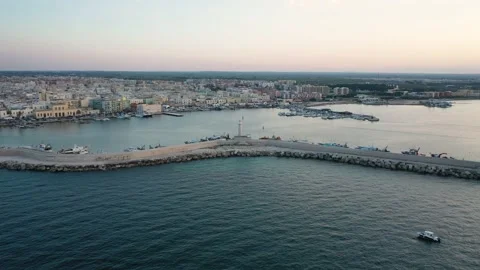 Aerial 4K video from flying drone on Molfetta port lighthouse Stock Footage 147457900