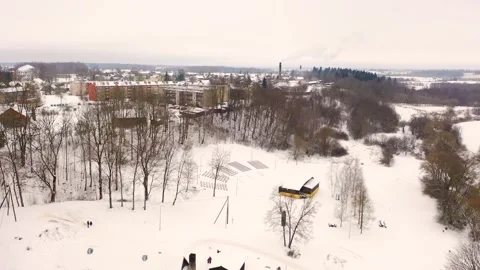 Aerial 4K video from flying drone to “Aknīste” city in winter.Latvia Stock Footage 304689202