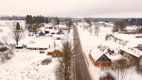 Aerial 4K video from flying drone to “Aknīste” city in winter.Latvia Stock Footage 304689301