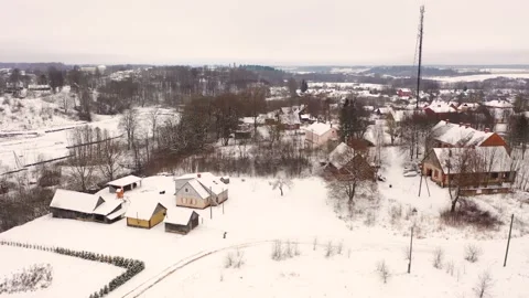 Aerial 4K video from flying drone to “Aknīste” city in winter.Latvia Stock Footage 304689461