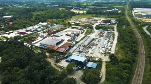 Aerial 4K view of a cement and concrete plant with machinery, storage yards.. Stock Footage 301543766