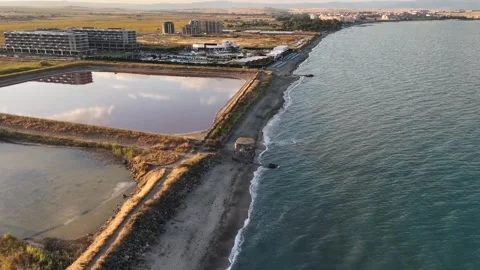 Aerial 4K View of Cloud Reflection in Pink Salt Lake and Black Sea Coastline 库存影片 342024425