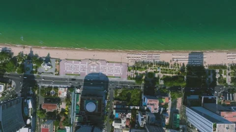 Aerial 4K view of crowded Nha Trang beach with tourists sunbathing Vietnam Stock Footage 333578808