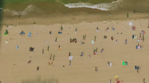 Aerial 4K view of crowded Nha Trang beach with tourists sunbathing Vietnam Stock Footage 333578812